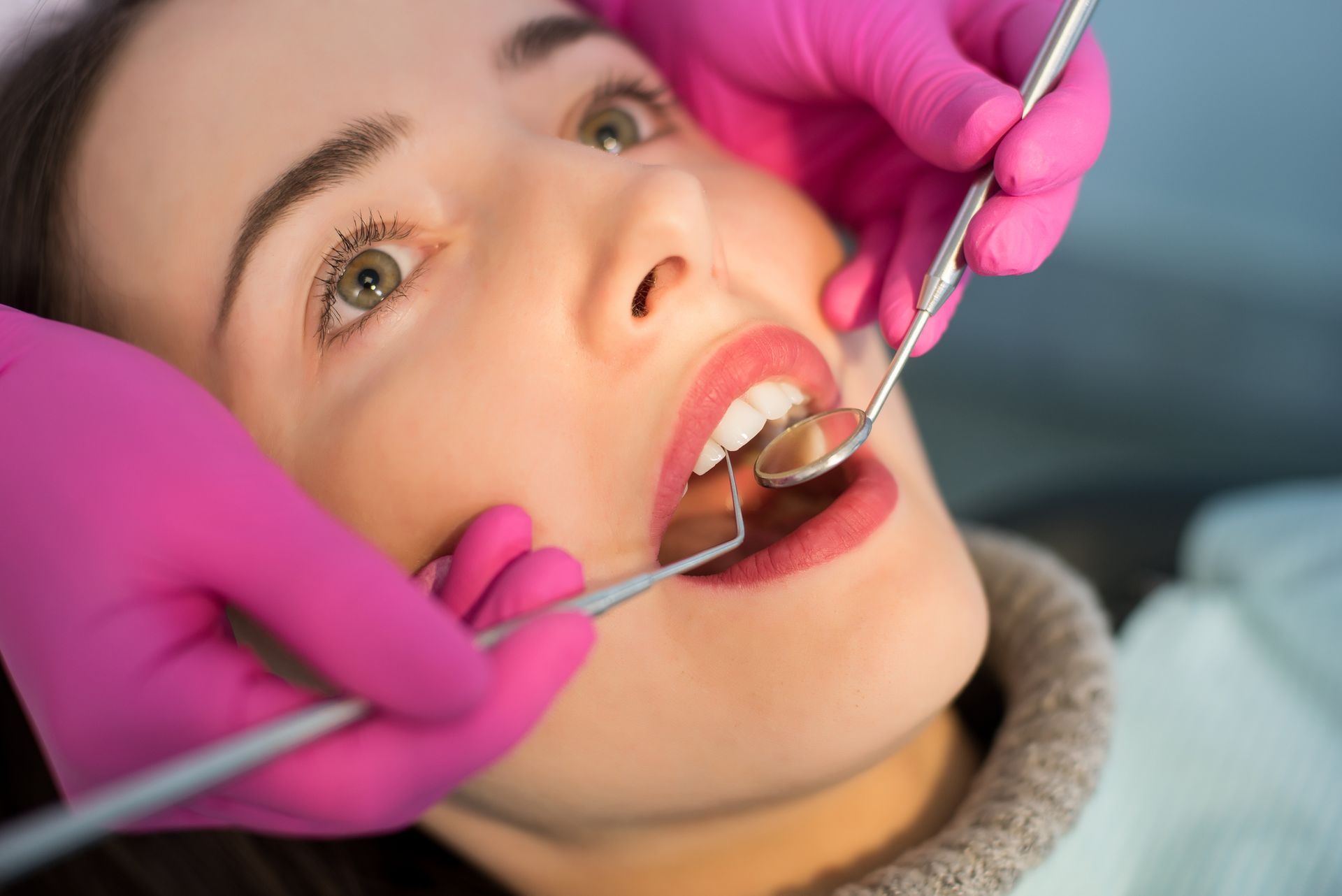 Person getting her teeth checked.